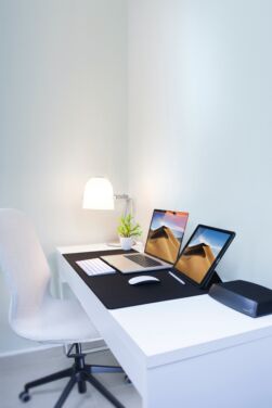 photo of laptop and tablet on the table